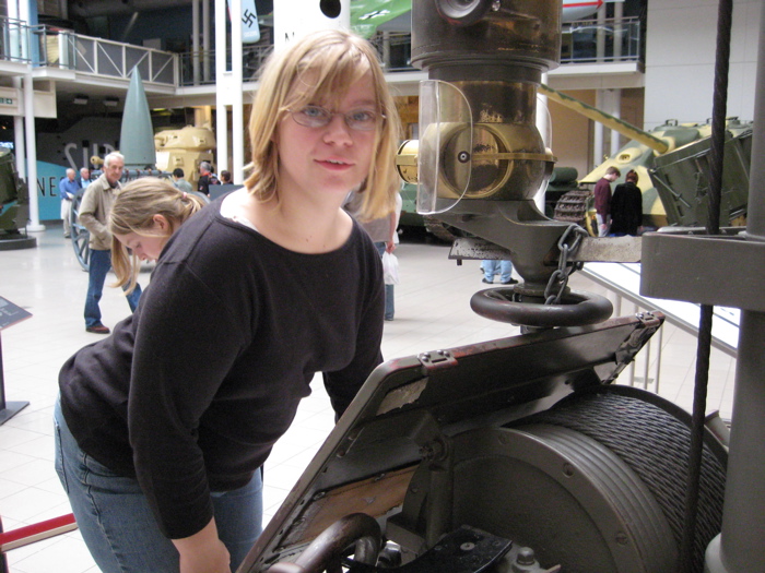 Jessica experiencing looking through a submarine periscope.