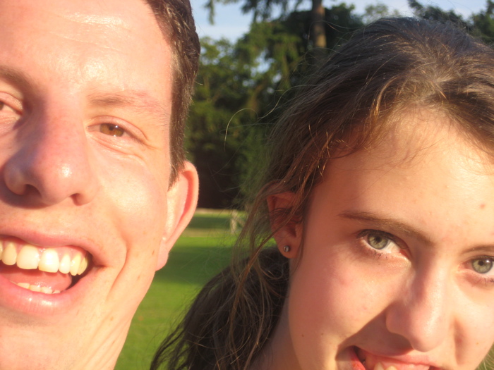 Jonathan and Amy look on and enjoy the sunshine.